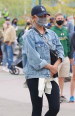 CHRISSY TEIGEN Out at Disneyland in Los Angeles 05/15/2021