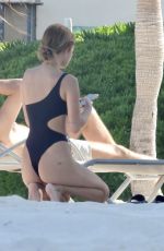 FRANCESCA FARAGO in a Black Swimsuit at a Beach 05/18/2021