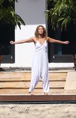 JENNIFER LOPEZ Stretches at Waterfront in Miami 05/25/2021