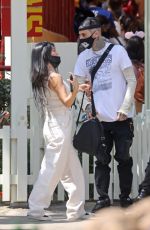 KOURTNEY KARDASHIAN and Travis Barker at Disneyland in Anaheim 05/19/2021