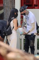 KOURTNEY KARDASHIAN and Travis Barker at Disneyland in Anaheim 05/19/2021