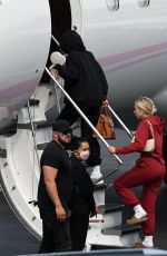 KYLIE JENNER and Travis Scott Boarding on a Jet in Miami 05/03/2021