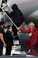 KYLIE JENNER and Travis Scott Boarding on a Jet in Miami 05/03/2021