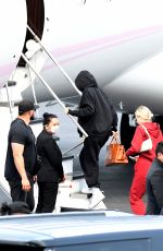 KYLIE JENNER and Travis Scott Boarding on a Jet in Miami 05/03/2021