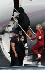 KYLIE JENNER and Travis Scott Boarding on a Jet in Miami 05/03/2021