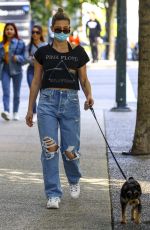 LILI REINHART in Ripped Denim Out with Her Dog in Vancouver 05/02/2021