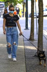 LILI REINHART in Ripped Denim Out with Her Dog in Vancouver 05/02/2021