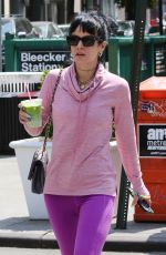 LILY ALLEN in a Pink Sweater and Purple Leggings Out in New York 05/20/2021