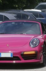 MICHELLE HUNZIKER Out Driving Her Porsche in Milan 05/12/2021