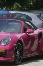MICHELLE HUNZIKER Out Driving Her Porsche in Milan 05/12/2021