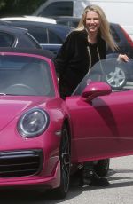 MICHELLE HUNZIKER Out Driving Her Porsche in Milan 05/12/2021