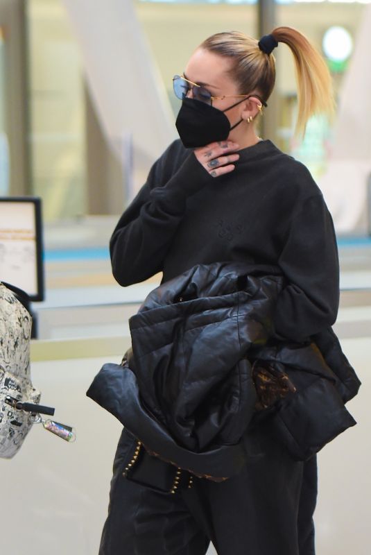 MILEY CYRUS All in Black Leaves Bowery Hotel in New York 05/09/2021