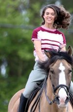 SABRINA BARTLETT Riding a Horse on the Set of The Larkins in London 05/12/2021
