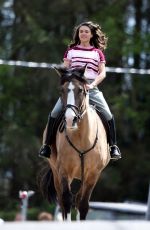 SABRINA BARTLETT Riding a Horse on the Set of The Larkins in London 05/12/2021