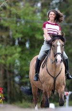 SABRINA BARTLETT Riding a Horse on the Set of The Larkins in London 05/12/2021