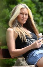 CAPRICE BOURRET in Denim Shorts Out at a Park in London 06/16/2021