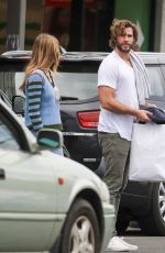 GABRIELLA BROOKS and Liam Hemsworth Out Shopping in Byron Bay 06/27/2021