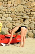 KATE HUDSON in Swimsuit at a Beach in Greece 06/13/2021