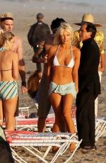 LILY JAMES in Biini as Pamela Anderson on the Set of Pam and Tommy in Cancun 06/21/2021