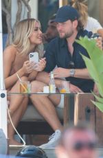 LOTTIE TOMLINSON and Lewis Burton on Vacation in Marbella 06/27/2021