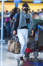 OLIVIA WILDE Arrives at JFK Airport in New York 06/28/2021
