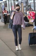 OLIVIA WILDE Arrives at LAX Airport in Los Angeles 06/20/2021
