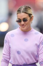 ASHLEY ROBERTS in a Purple Mini Skirt and Polka Dot Top at Heart Radio in London 07/13/2021