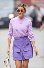 ASHLEY ROBERTS in a Purple Mini Skirt and Polka Dot Top at Heart Radio in London 07/13/2021