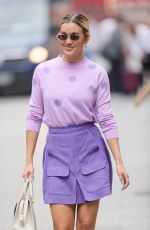 ASHLEY ROBERTS in a Purple Mini Skirt and Polka Dot Top at Heart Radio in London 07/13/2021