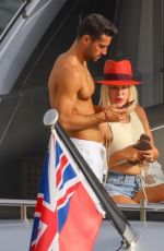 CAROLINE STANBURY in Bikini and Sergio Carrallo on Holiday in Mykonos 07/02/2021
