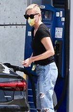 CHARLIZE THERON in Ripped Demim at a Gas Station in West Hollywood 07/24/2021