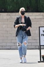 CHARLIZE THERON in Ripped Denim Out Shopping in Beverly Hills 07/16/2021