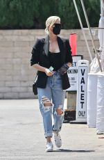 CHARLIZE THERON in Ripped Denim Out Shopping in Beverly Hills 07/16/2021