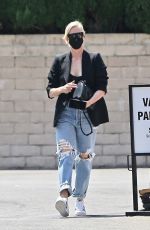 CHARLIZE THERON in Ripped Denim Out Shopping in Beverly Hills 07/16/2021