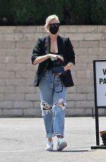 CHARLIZE THERON in Ripped Denim Out Shopping in Beverly Hills 07/16/2021