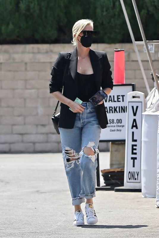 CHARLIZE THERON in Ripped Denim Out Shopping in Beverly Hills 07/16/2021