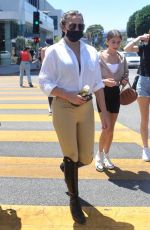 CHRISSY TEIGEN Out Shopping for Sunglasses in West Hollywood 07/20/2021