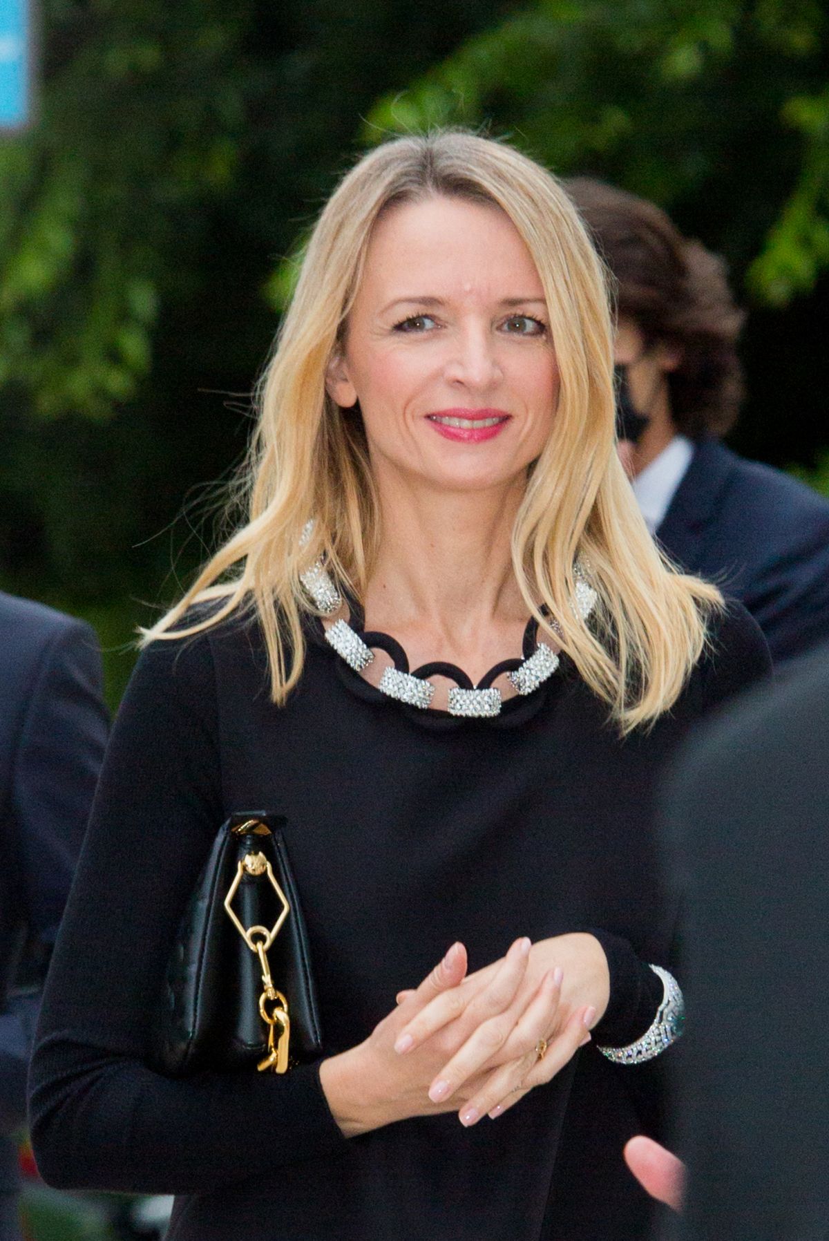 Delphine Arnault with her husband during Louis Vuitton Champs