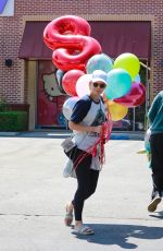 KATE MARA Picks up Balloons to Celebrate Her Stepson