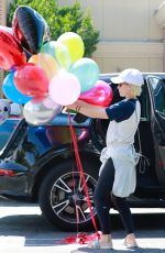 KATE MARA Picks up Balloons to Celebrate Her Stepson