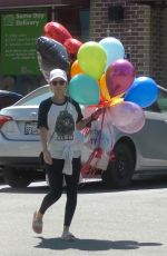 KATE MARA Picks up Balloons to Celebrate Her Stepson