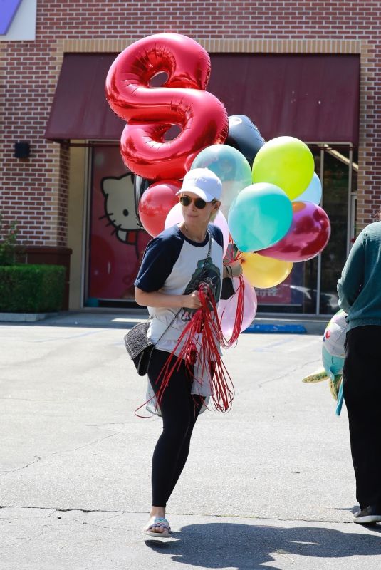 KATE MARA Picks up Balloons to Celebrate Her Stepson