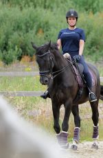 KATIE PRICE Riding a Horse at Her Stables in Essex 07/22/2021