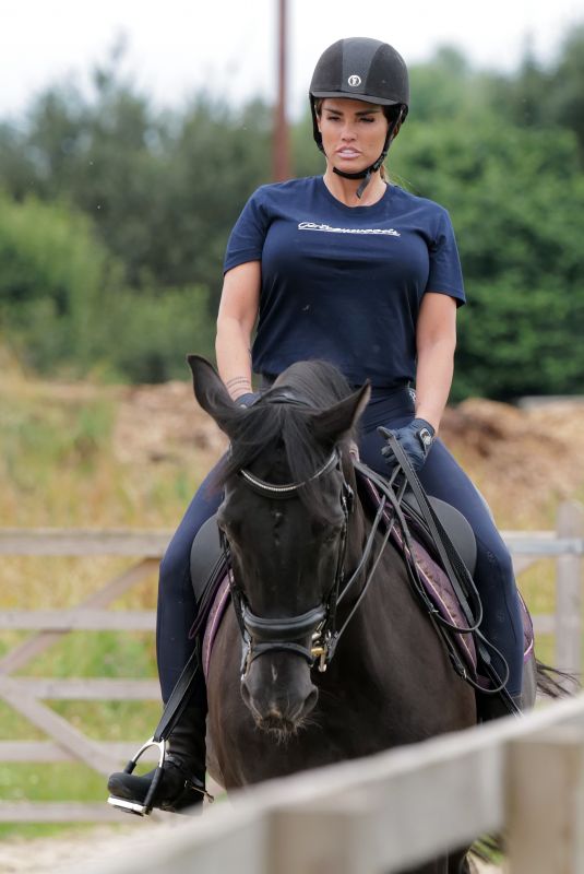 KATIE PRICE Riding a Horse at Her Stables in Essex 07/22/2021