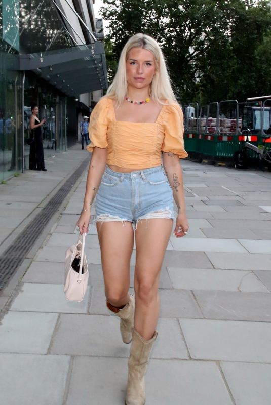 LOTTIE MOSS in Denim SHorts Arrives at 180 Strand in London 07/17/2021