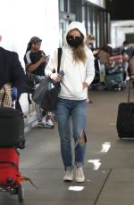 OLIVIA WILDE in Ripped Denim at LAX Airport in Los Angeles 07/19/2021