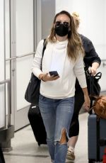 OLIVIA WILDE in Ripped Denim at LAX Airport in Los Angeles 07/19/2021