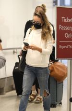 OLIVIA WILDE in Ripped Denim at LAX Airport in Los Angeles 07/19/2021