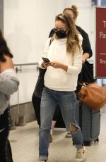 OLIVIA WILDE in Ripped Denim at LAX Airport in Los Angeles 07/19/2021
