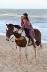 ALESSANDRA AMBROSIO in a Red Bikini Riding a Horse at a Beach in Trancoso 08/05/2021